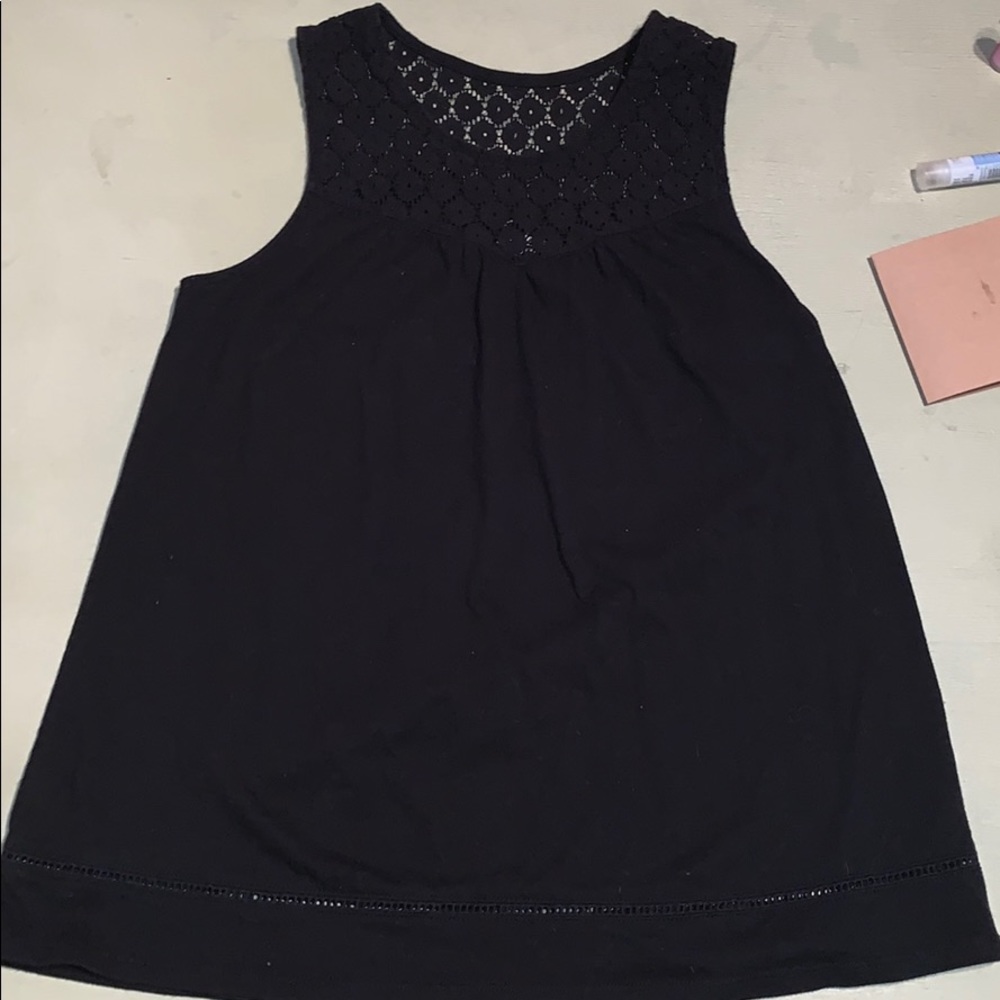 A black lace cut tank top